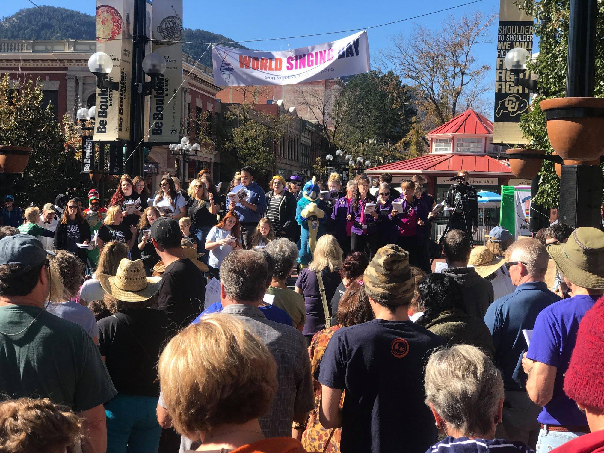 The chorus performing at World Singing Day on Pearl Street